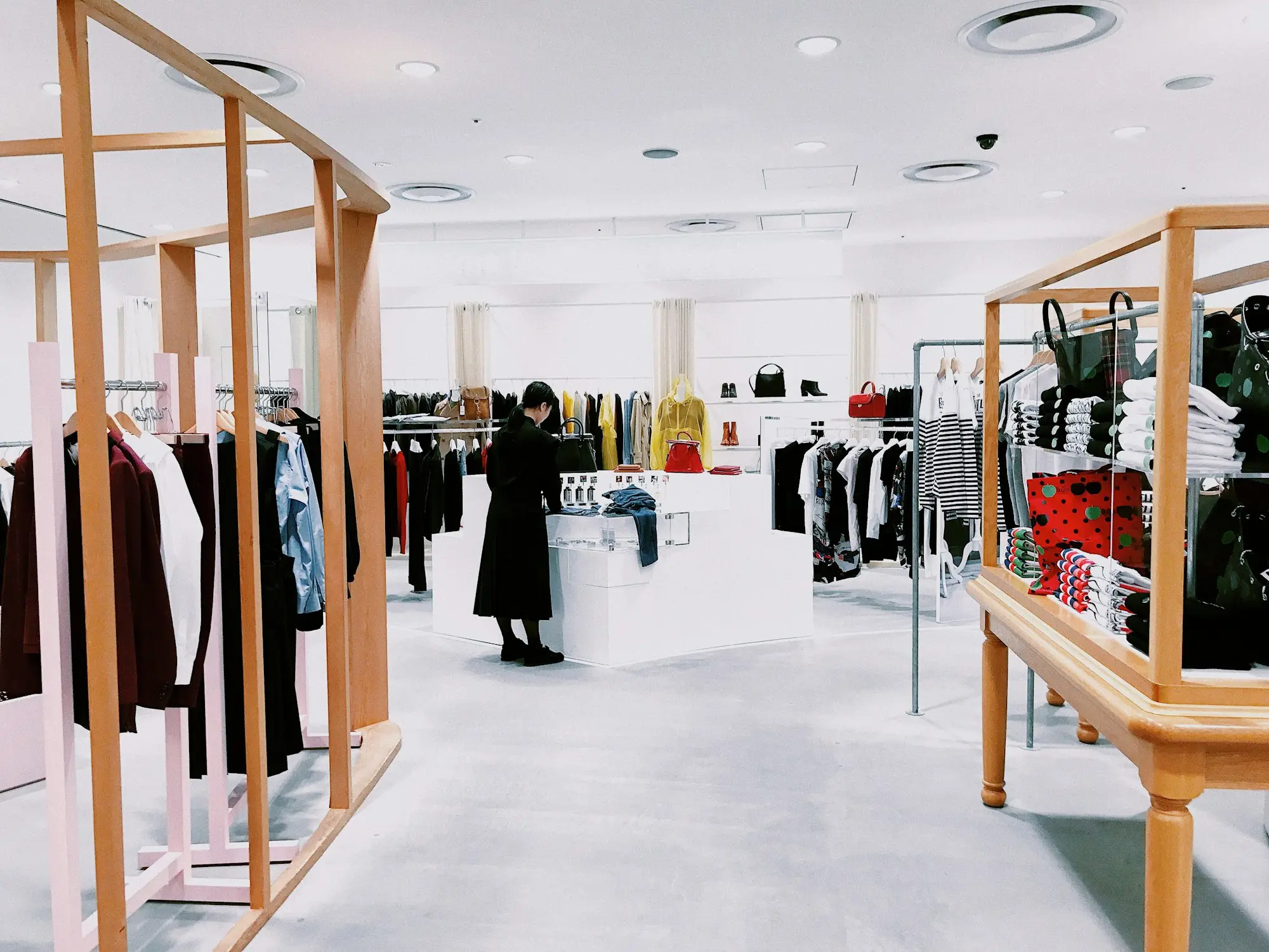 Shopfitter installing timber display shelving during a small retail shop fit-out